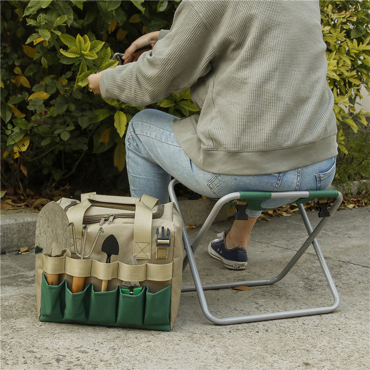 Person sitting on a small folding stool next to a tool bag outdoors.